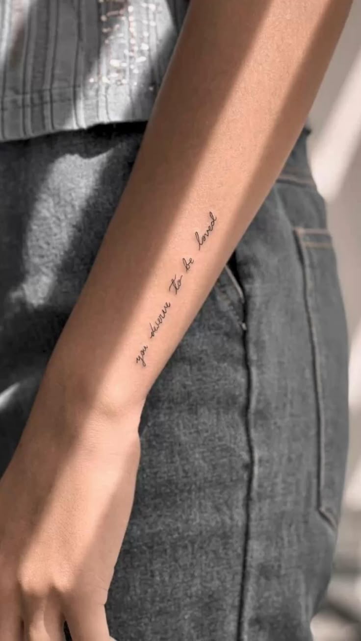 "You Deserve to Be Loved” Minimalist Script Tattoo